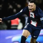 Kylian Mbappé in a PSG kit during a match, representing his crucial role at Paris Saint-Germain amidst ongoing contract negotiations.