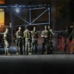Middle East Conflict: Lebanese soldiers stand guard as their comrades prepare to detonate a walkie-talkie that was found at the parking of the American University Hospital, in Beirut, Lebanon, Wednesday, Sept. 18, 2024.